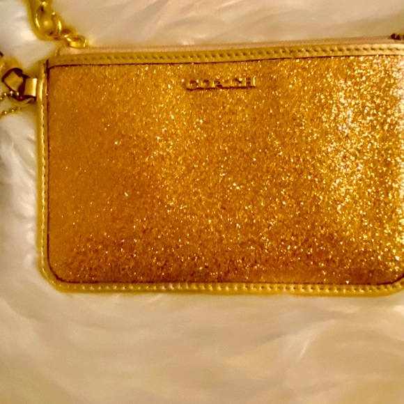 Coach Handbags - 🆕COACH GOLD SPARKLY CUTE WRISTLET THAT YOU ARE GOING TO LOVE. HOLDS PHONE ETC.
